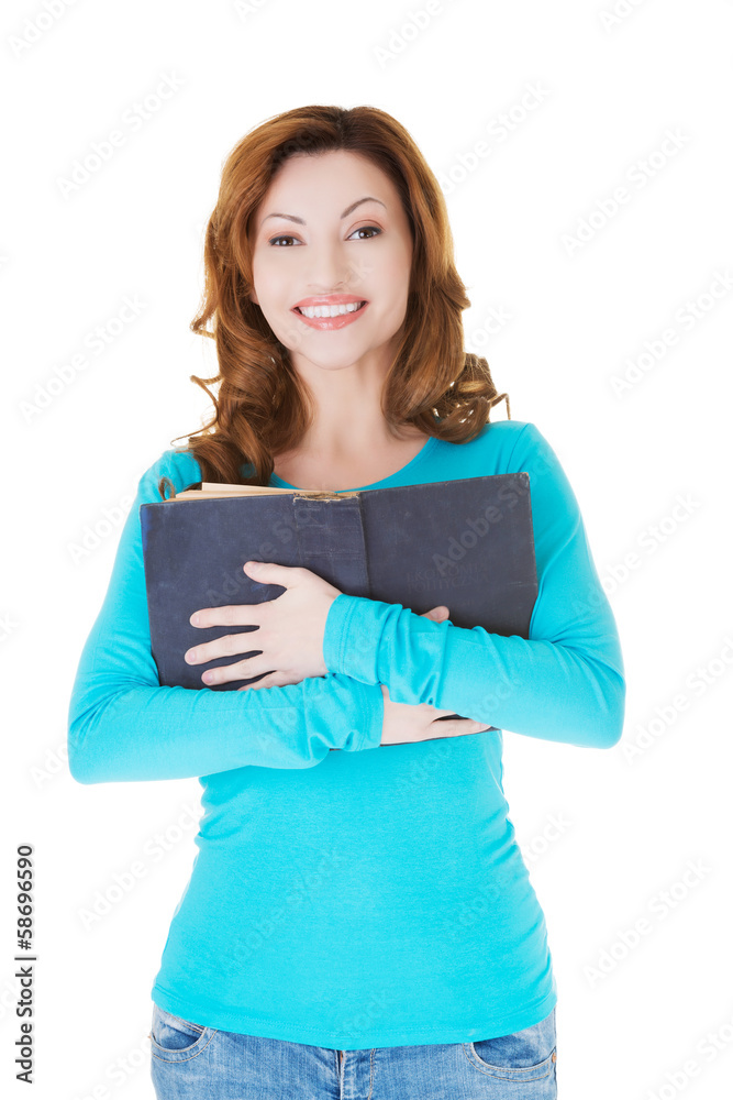 Attractive casual woman holding an open book. Attractive casual woman holding an open book.