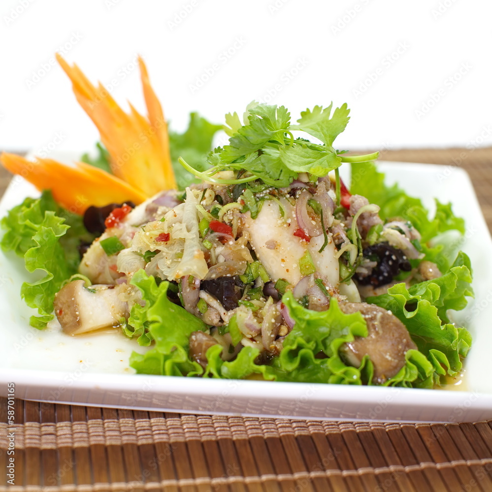 Spicy salad with pork and green herb in Thai style