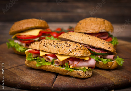 Sandwiches on the wooden table photo