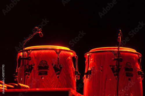 Steel drums illuminated on a stage