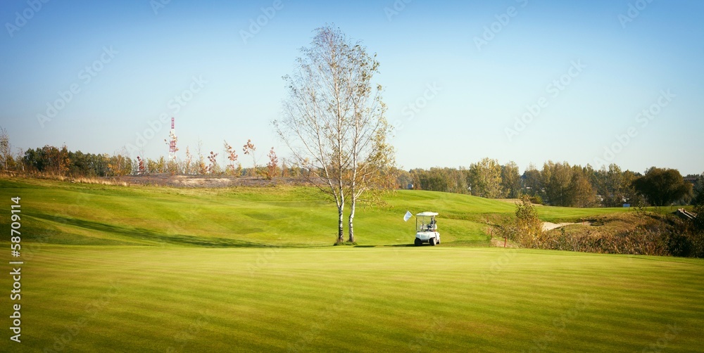 Golf-cart car on field of golf course Golf-cart car on field of golf course