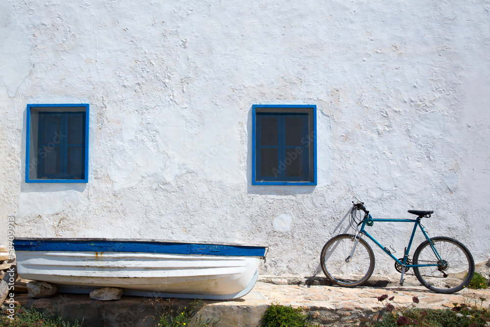 Mediterranean boat bicycle and white wall in white Mediterranean boat bicycle and white wall in white