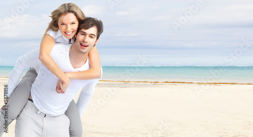 Happy couple on Punta Cana beach. © grinny