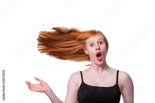 Redhead woman hair blowing sideways - humorous concept