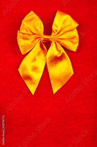 Yellow ribbon on velvet background