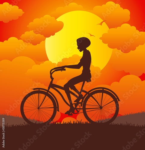 Women riding a bicycle. © intararit