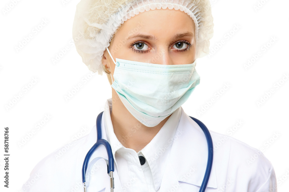 Portrait of serious young woman doctor with mask and cap. Portrait of serious young woman doctor with mask and cap.