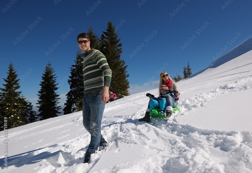 family having fun on fresh snow at winter vacation family having fun on fresh snow at winter vacation