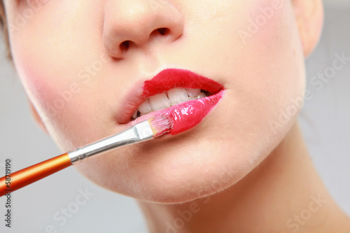 Makeup.Professional Make-up. Lipgloss. Lipstick © lenets_tan