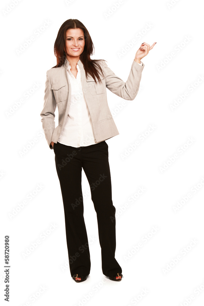 A young woman pointing at a copyspace