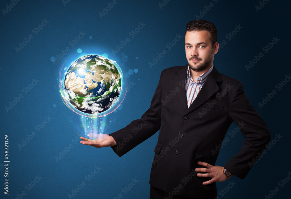 Businessman holding glowing earth globe Businessman holding glowing earth globe