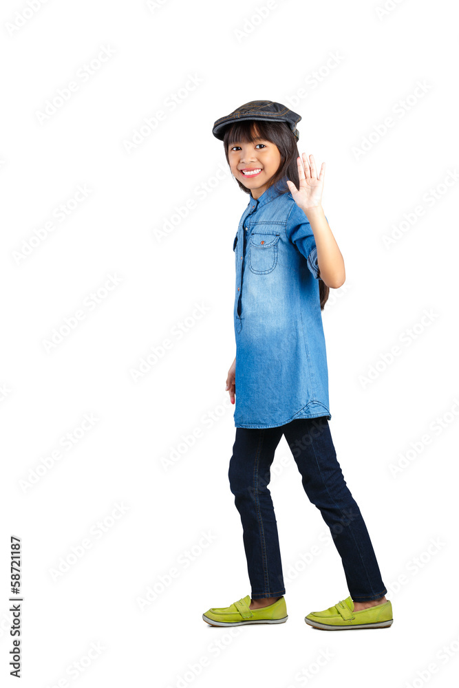 Smiling asian little girl in the action of walking Smiling asian little girl in the action of walking
