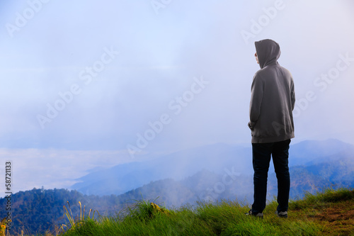 Teenager asian boy standing at mountain © Patrick Foto