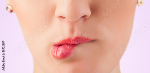 Beautiful woman red lips close up photo