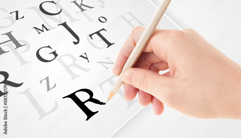 Hand writing various letters on white plain paper