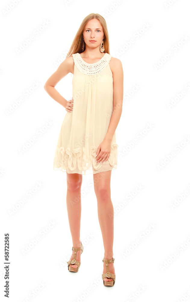Cute young blonde woman posing in stylish dress. Cute young blonde woman posing in stylish dress.