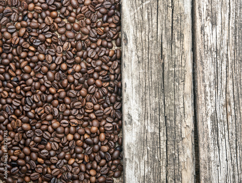 Coffee beans border old wood background