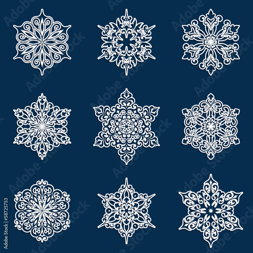 Set of white lacy ornamental snowflakes