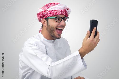 Excited, handsome Arab man expressing success © Ramzi