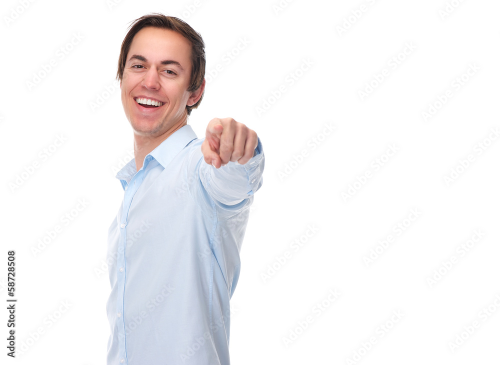 Horizontal portrait of a young man smiling and pointing finger Horizontal portrait of a young man smiling and pointing finger