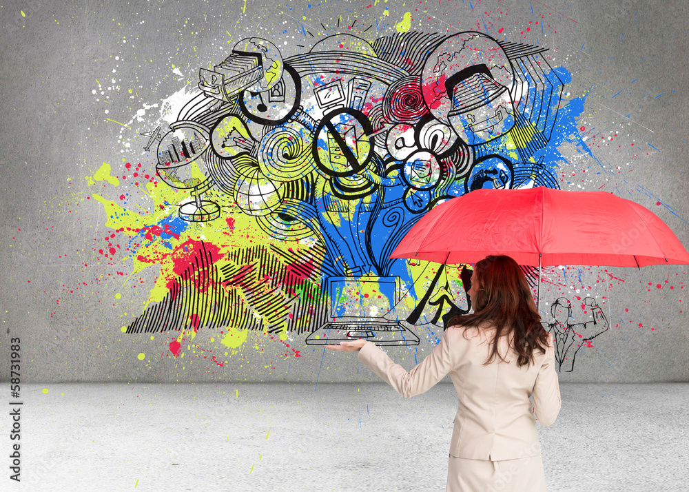 Fototapeta premium Composite image of businesswoman holding umbrella