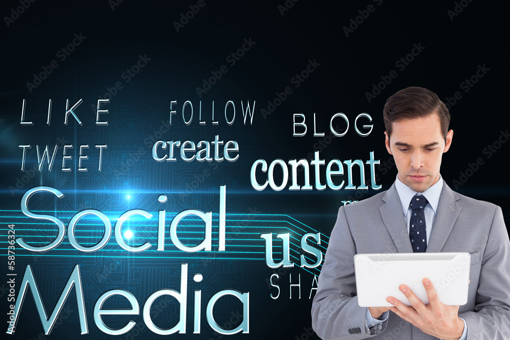 Composite image of businessman holding a tablet computer Composite image of businessman holding a tablet computer