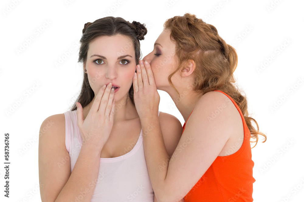 Two young female friends gossiping Two young female friends gossiping