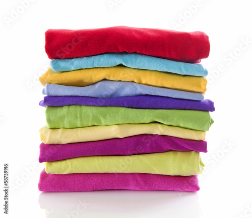 Pile of colorful clothes over white background