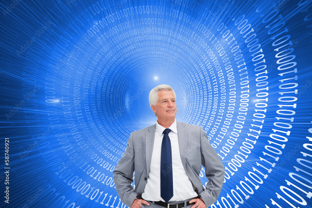 Composite image of man in a suit with his hands on his hips Composite image of man in a suit with his hands on his hips
