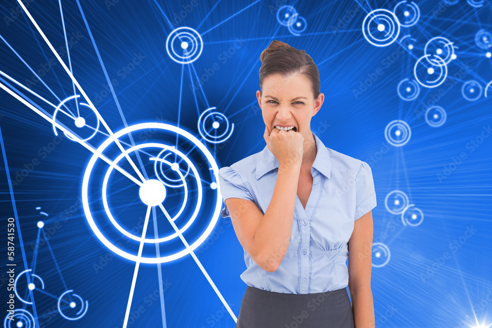 Composite image of furious businesswoman looking at the camera Composite image of furious businesswoman looking at the camera