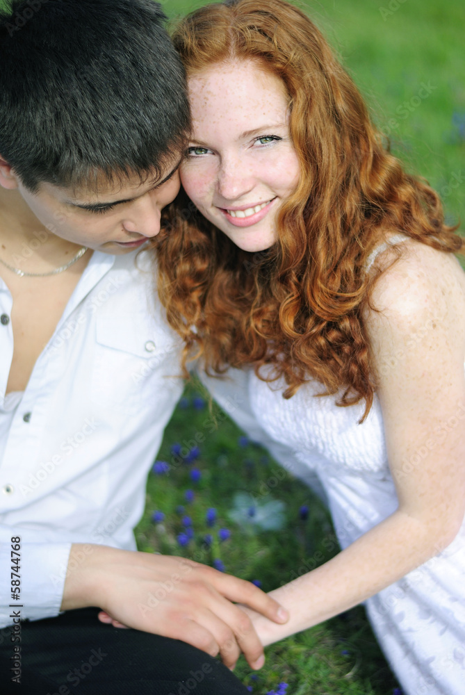 Obraz premium beautiful young couple in love on a green glade