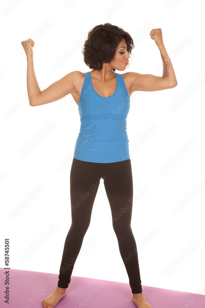Hispanic woman flex kiss at muscle