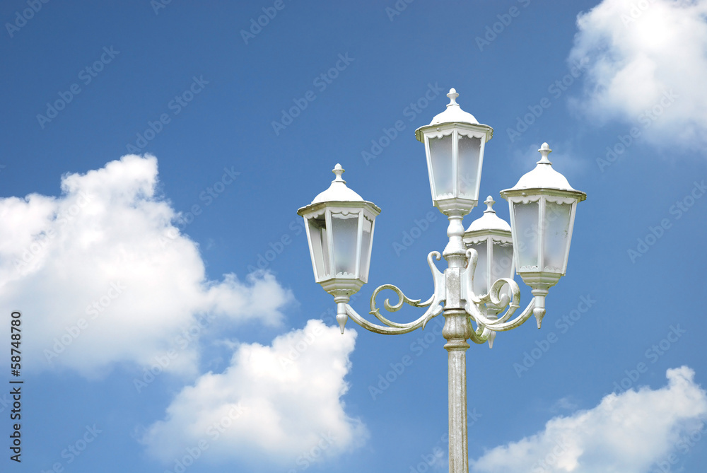 vintage street lamppost with blue sky