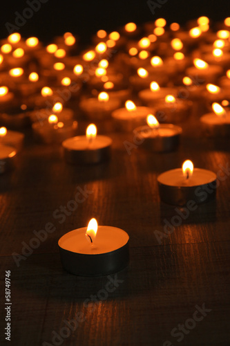 Burning candles on dark background