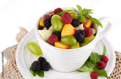 Fruit salad in cup on napkin isolated on white