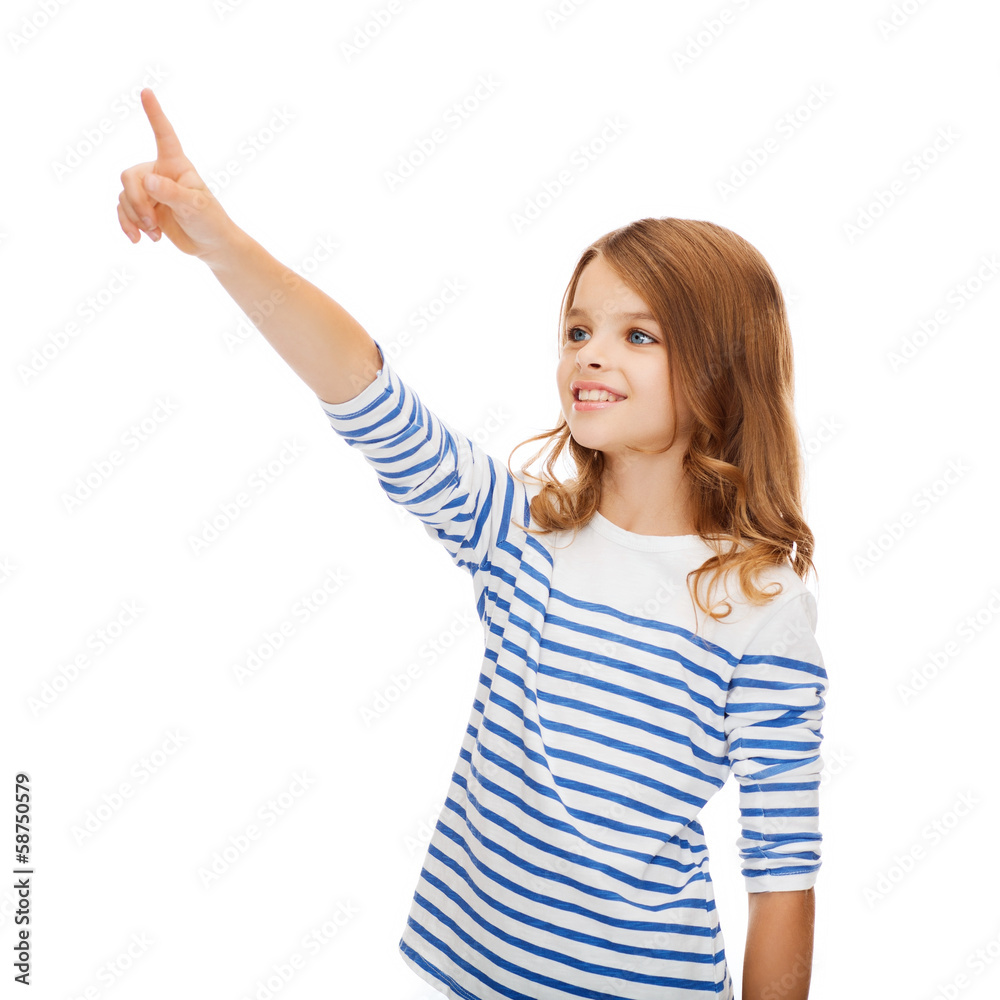 smiling girl pointing at virtual screen