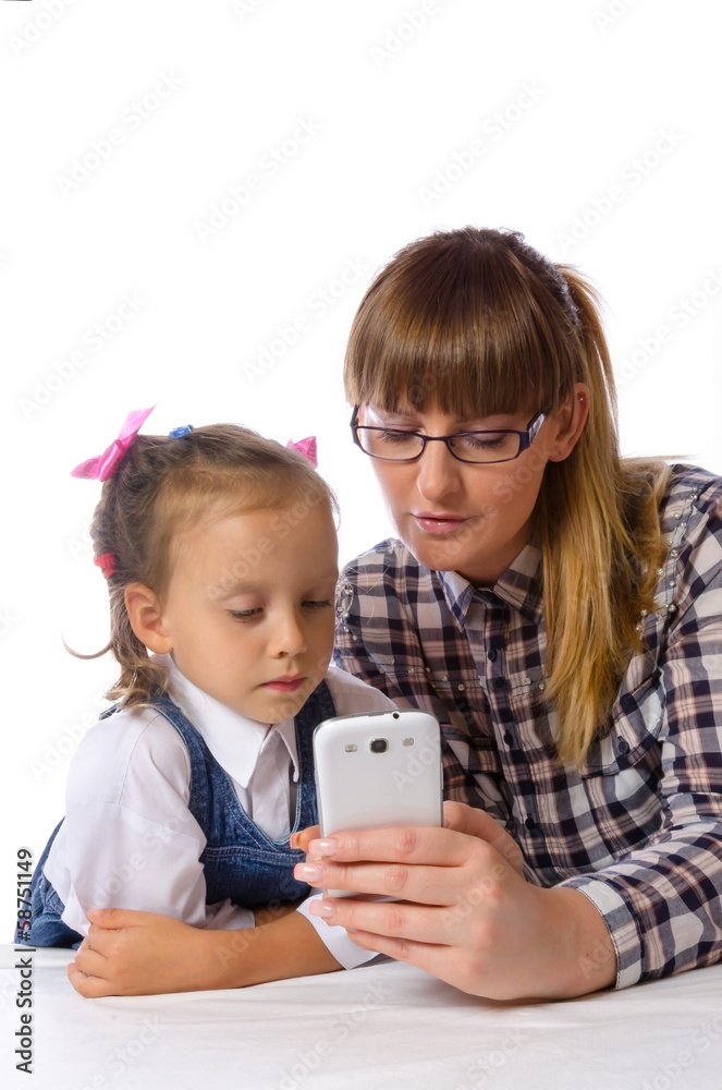 mother and daughter with mobile phone mother and daughter with mobile phone