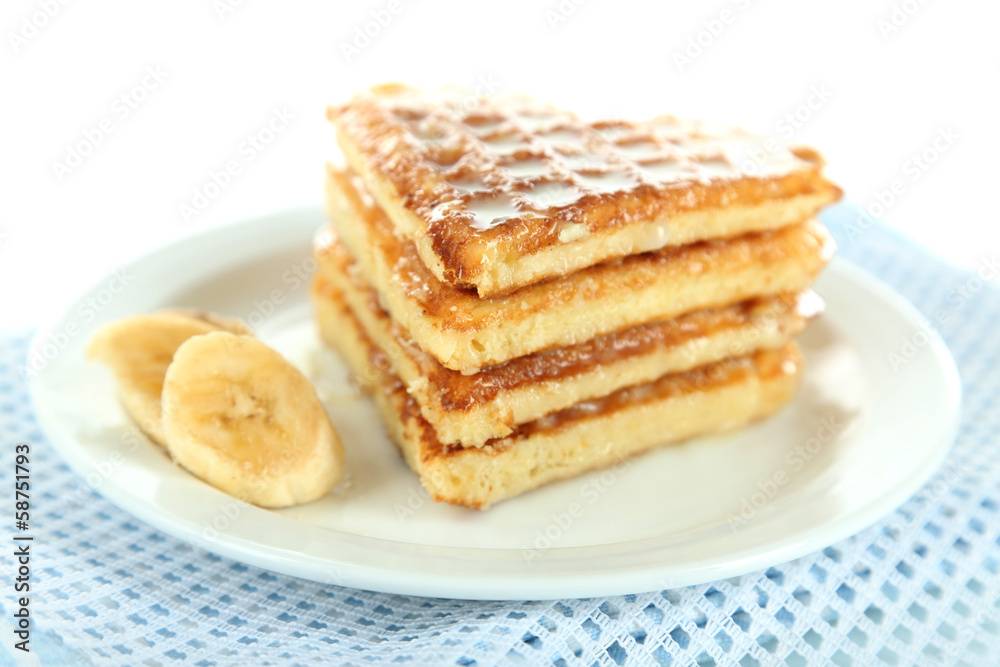 Sweet Belgium waffles with banana, isolated on white