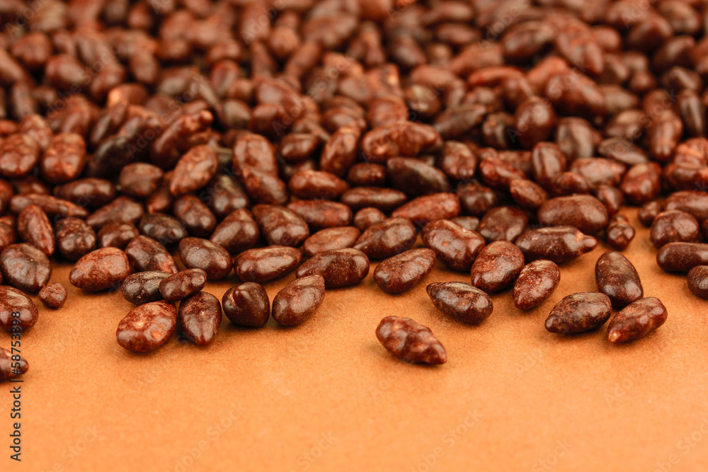 Sunflower grains in chocolate, on brown background Sunflower grains in chocolate, on brown background