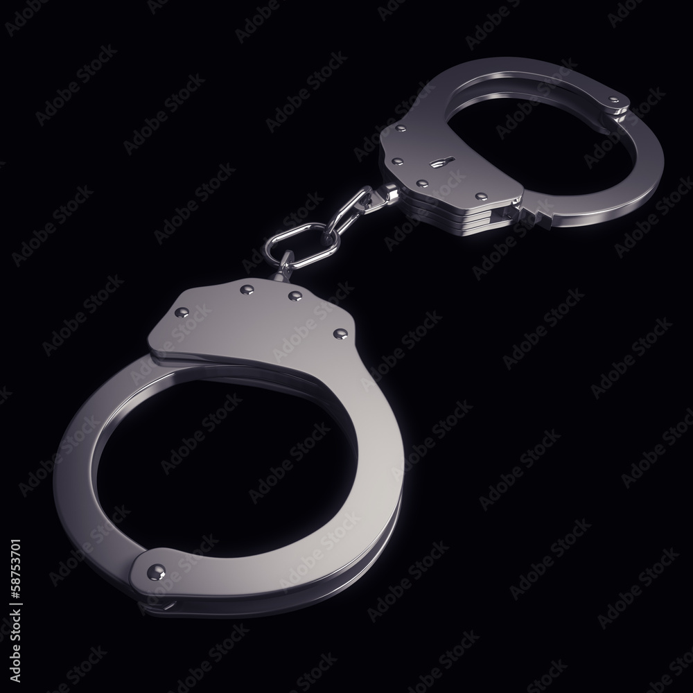 Silver handcuffs isolated with clipping path on black Silver handcuffs isolated with clipping path on black