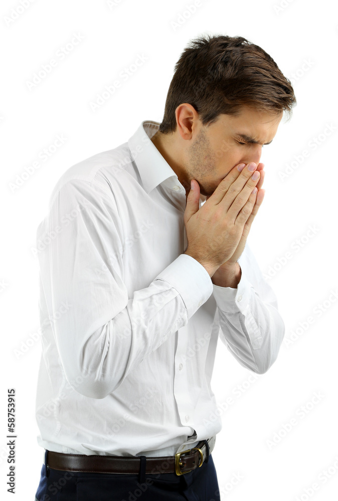 Sneezing young man isolated on white Sneezing young man isolated on white