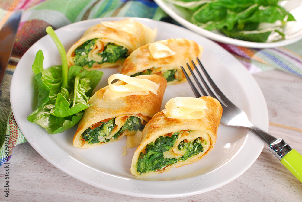 rolled spinach pancakes cut into small pieces rolled spinach pancakes cut into small pieces