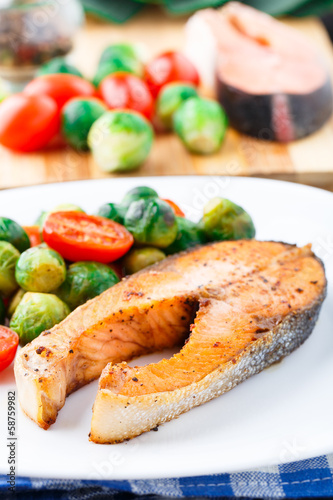 Salmon with roasted brussels sprout and tomato