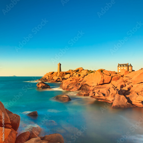 Fotografering Ploumanach lighthouse sunset in pink granite coast, Brittany, Fr