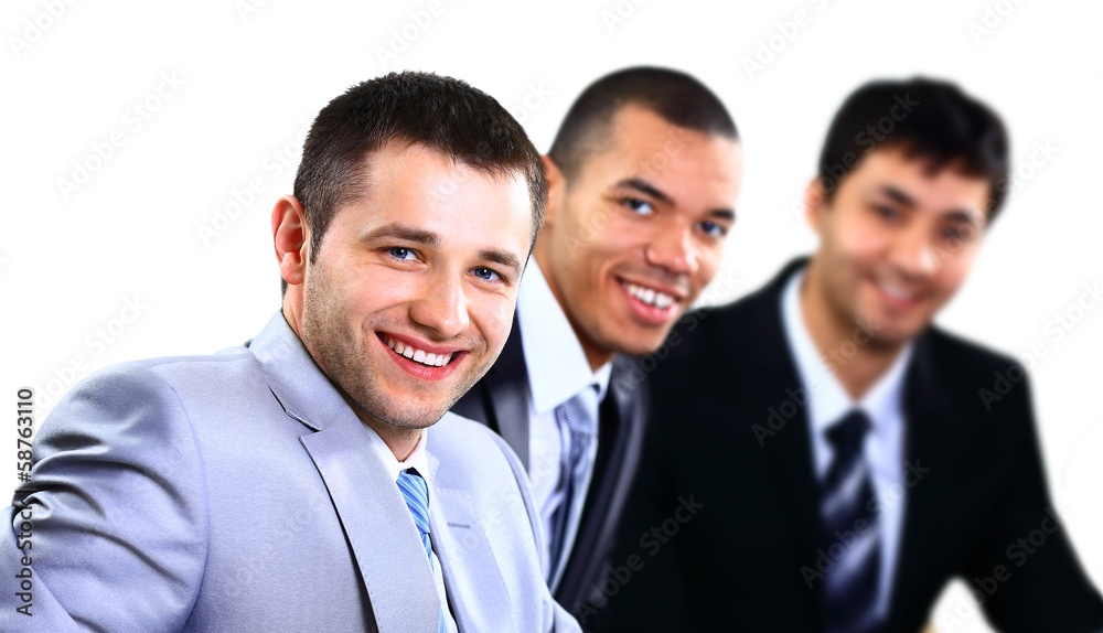 Happy smart business man with team mates in the background Happy smart business man with team mates in the background