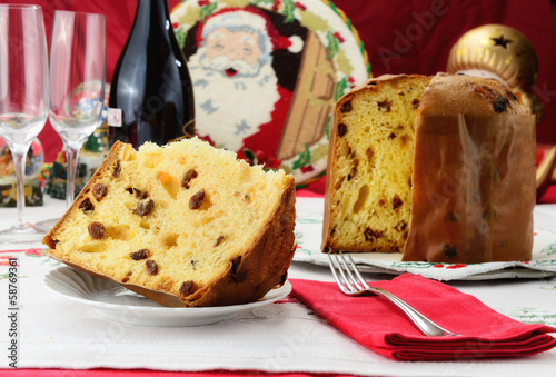 Panettone dolce natalizio lombardo su  tavola addobbata photo