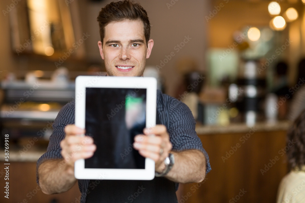 Cafe Owner Holding Digital Tablet In Restaurant Cafe Owner Holding Digital Tablet In Restaurant