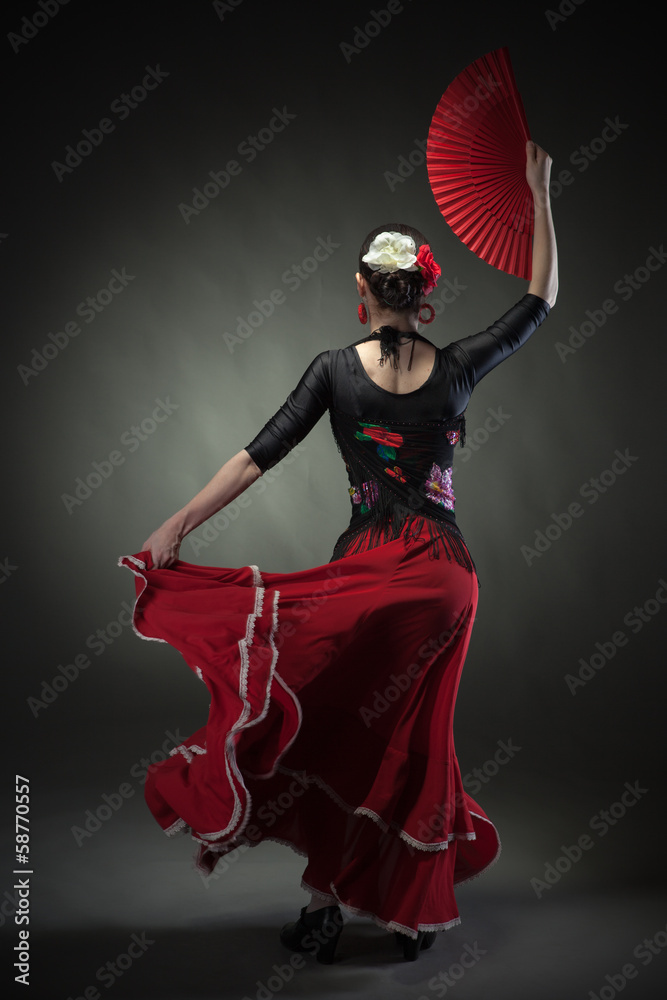 young woman dancing flamenco with fan on black - obrazy, fototapety, plakaty 