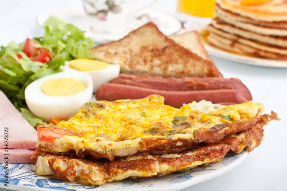 omelette with ham, bacon and vegetables close up omelette with ham, bacon and vegetables close up