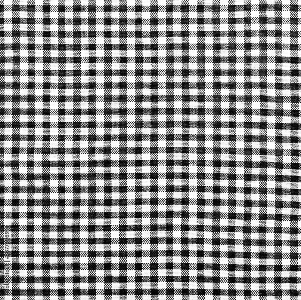 Black-and-white checkered cloth as background Black-and-white checkered cloth as background